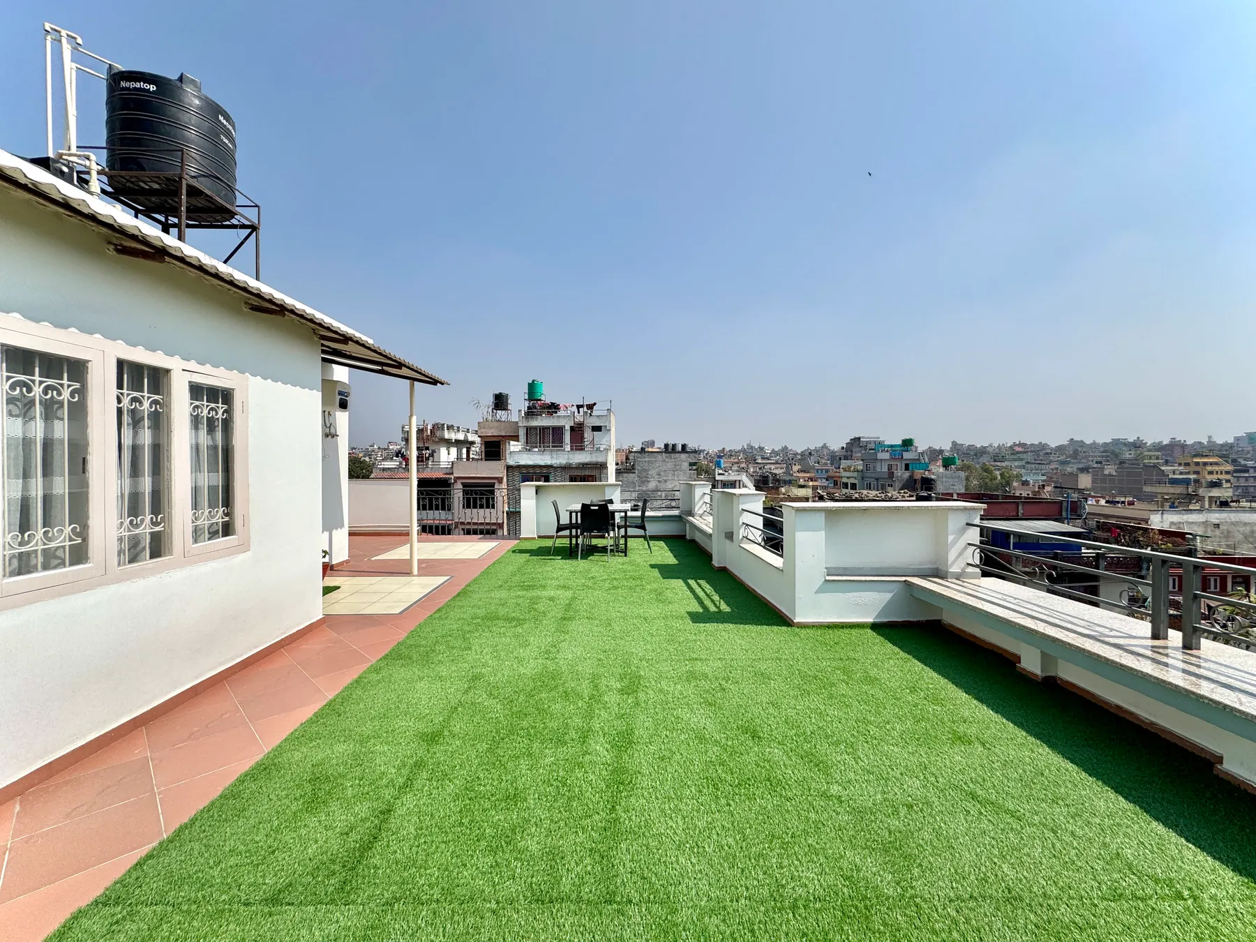Open rooftop terrace with Kathmandu city views