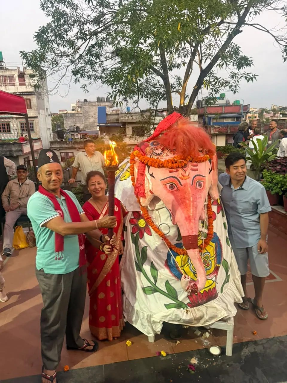 Guests and community members welcoming Pulukisi on the residence rooftop during Indra Jatra